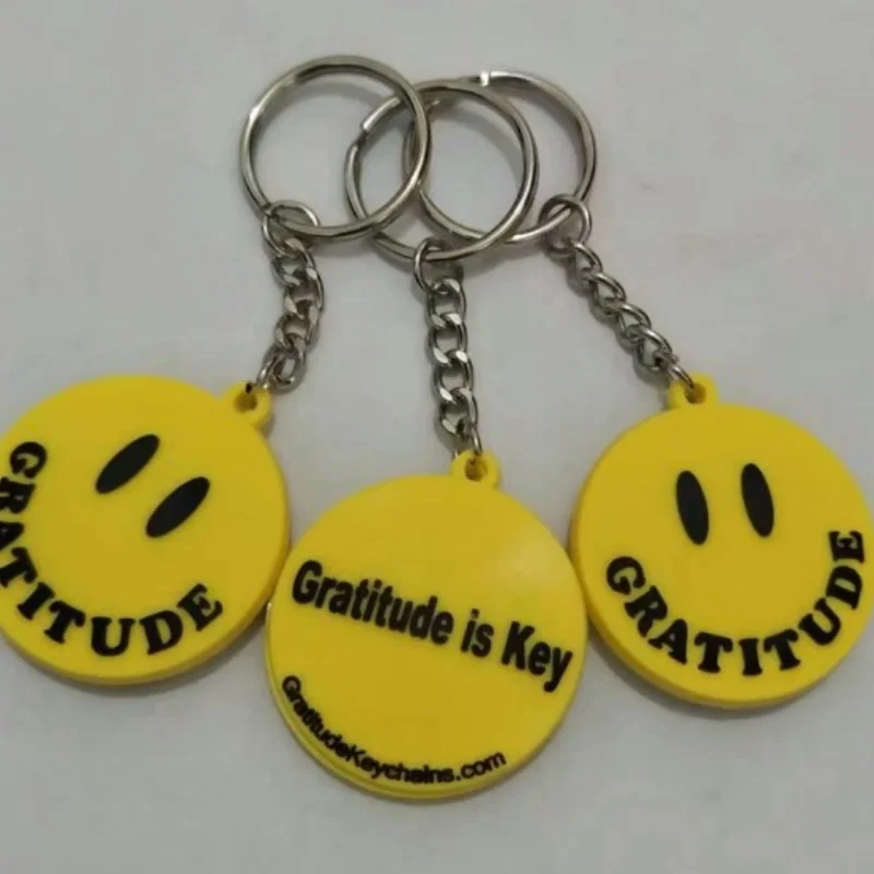 Corrente chave personalizada do PVC com cara do sorriso, amarelo