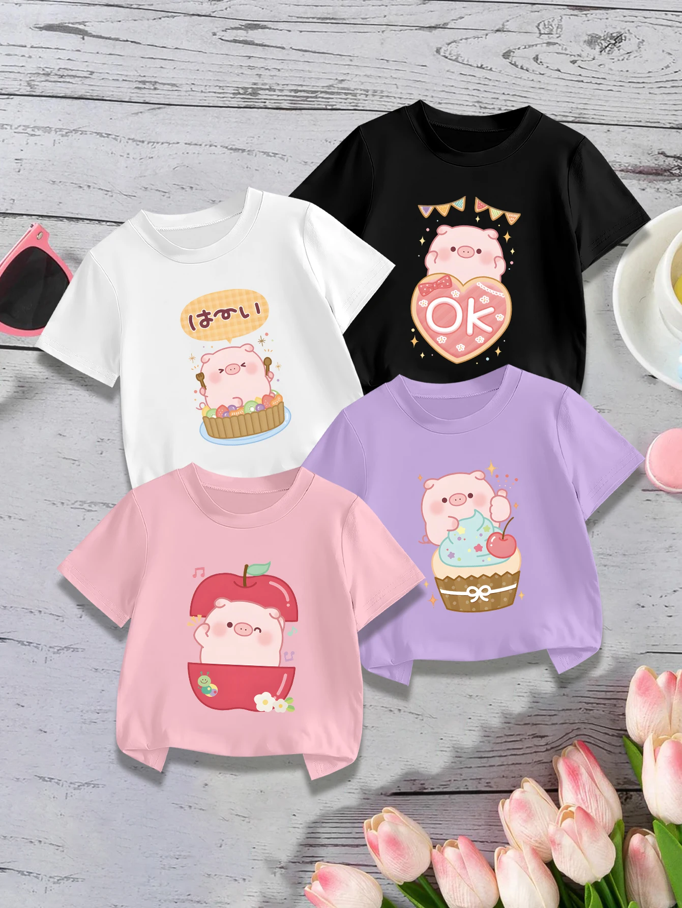 

4 предмета: летние футболки для девочек с милым принтом в виде мультяшных яблок, свинок и тортов.