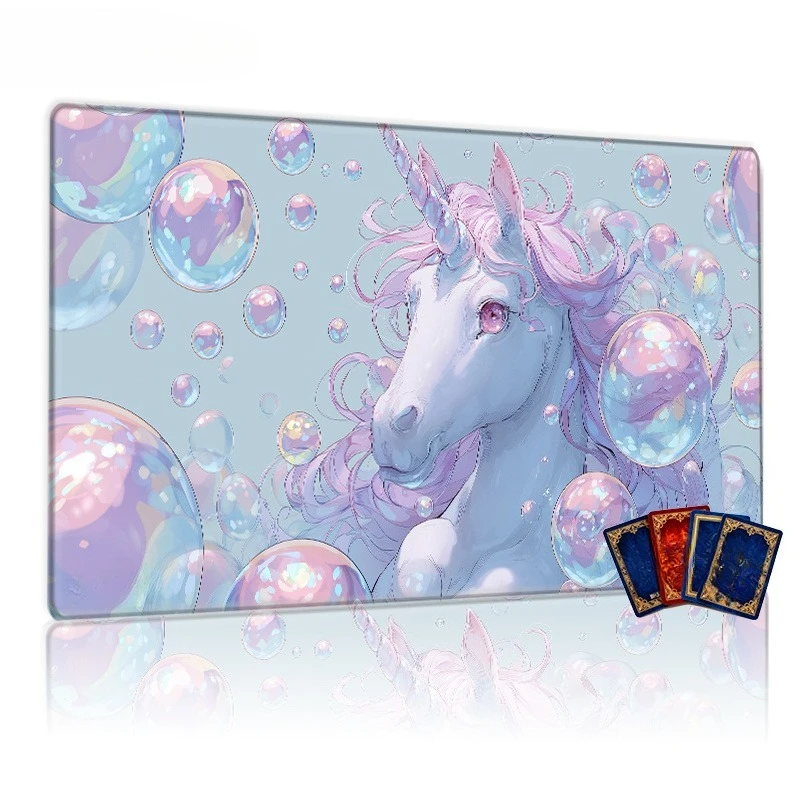 A white unicorn game mat with pink flowing mane and spiral-shaped horns, featuring a non-slip backing, is perfect for collectors