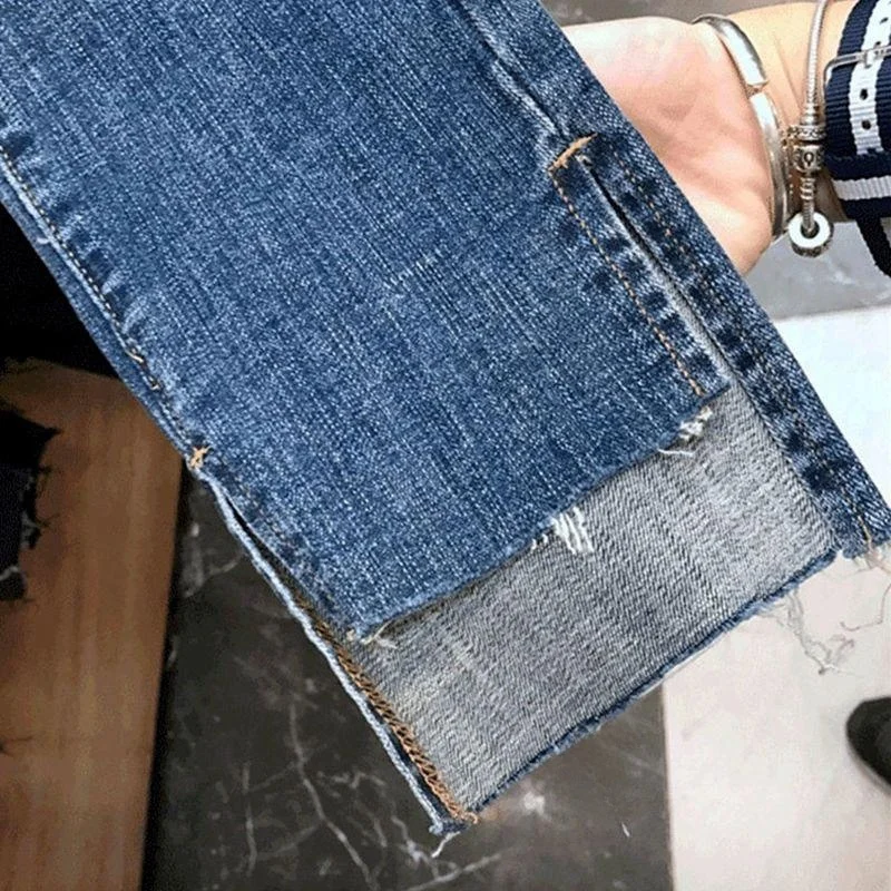 Hoge taille afslankende denim jeans Dames Faion potloodbroek Asymmetrische split Enkellange rechte pijpen Trendy gescheurd gat
