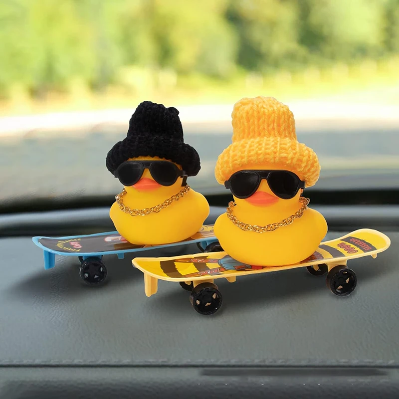 A Rubber Duck Car Ornament With A Cowboy Hat, Glasses, And A Gold AK-47 Necklace - Interior Decoration Of The Vehicle