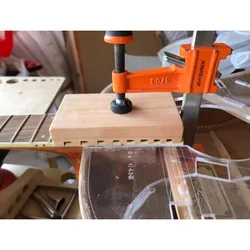 Adhesive pad at the end of guitar fingerboard