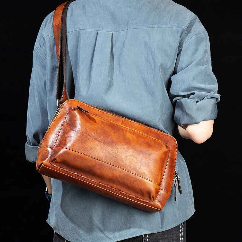 Casual messenger bag men's first leather shoulder bag leather men's bag fashion Korean handmade backpack tide brand.