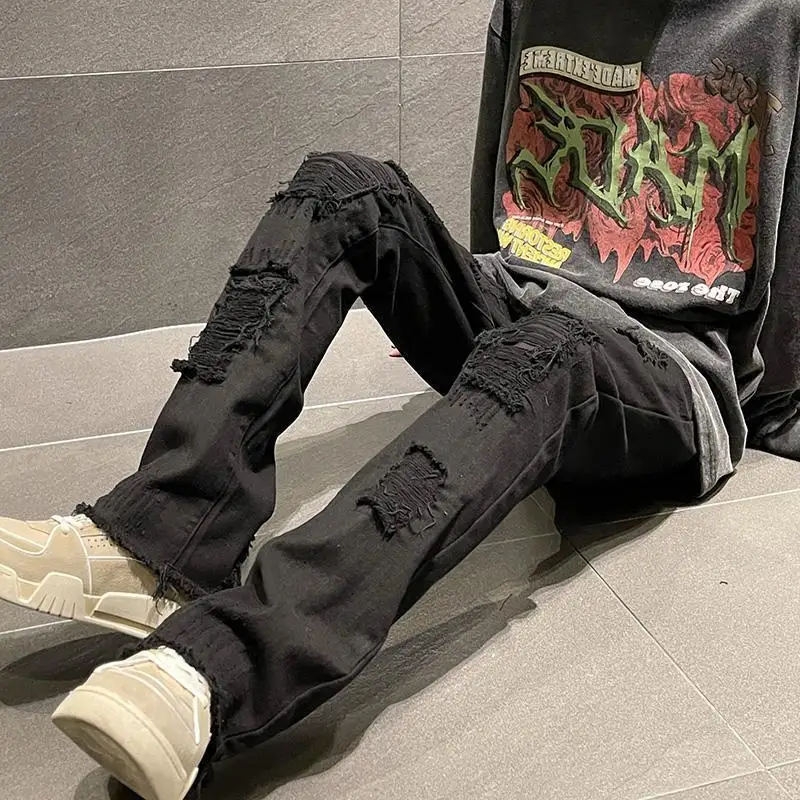 

European and American high street trousers, American street black jeans, men's new style, fake ripped holes, raw edge trousers