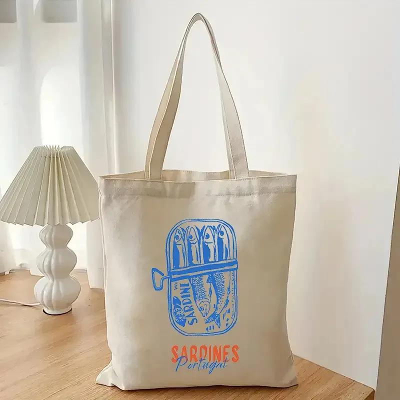 

Vintage-Style Tote Bag Italian Summer Sardines, Designed Sardine Can Architectural Print in Light Beige, Accented Blue Orange.