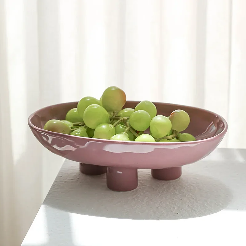 

Modern simple and creative hand-squeezed ceramic three-legged high fruit plate, home living room entrance desktop fruit plate