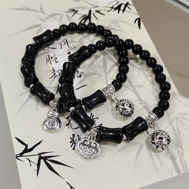 La fortuna del estilo chino gira la pulsera retro de bambú de la campana para los regalos de fiesta judíos de las mujeres