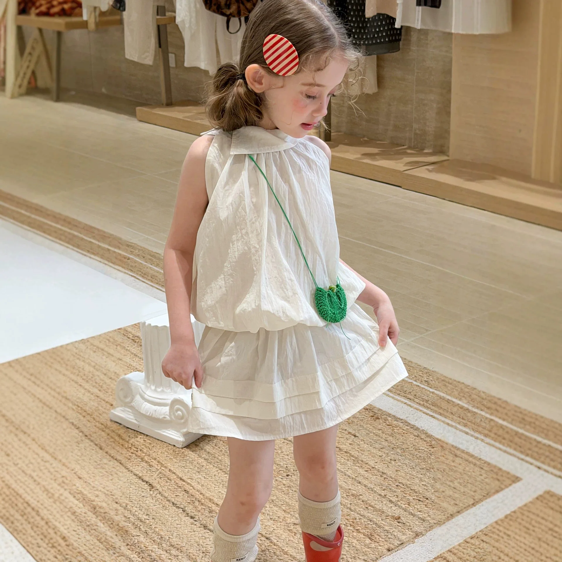 

2026 Summer New Girls' Solid Color Design Sweet Sleeveless Loose Top Half Skirt Two-piece Set