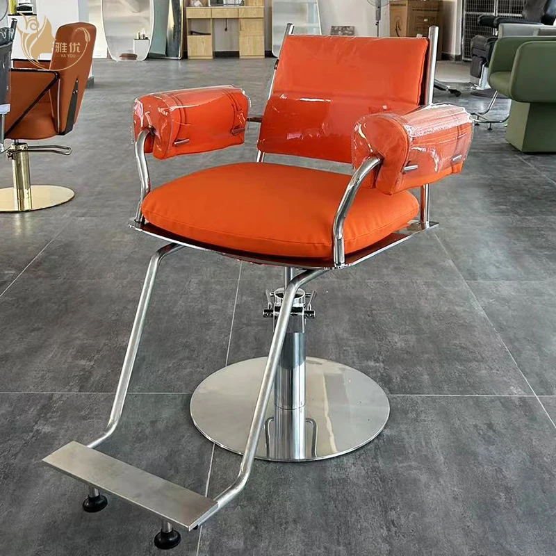 

Modern Orange Salon Barber Chair With Chrome Frame And Padded Armrests