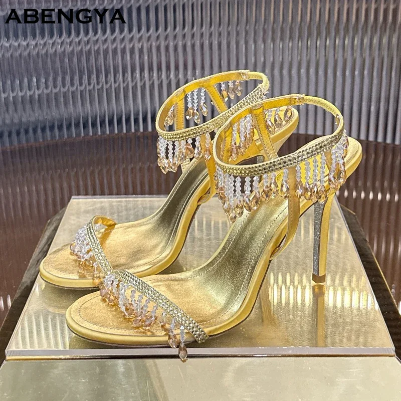 

Summer Sexy Leather High Heel Sandals Women Crystal Pendant Ankle Snake Strap Dress Shoes Designer Fashion Party Wedding Shoes
