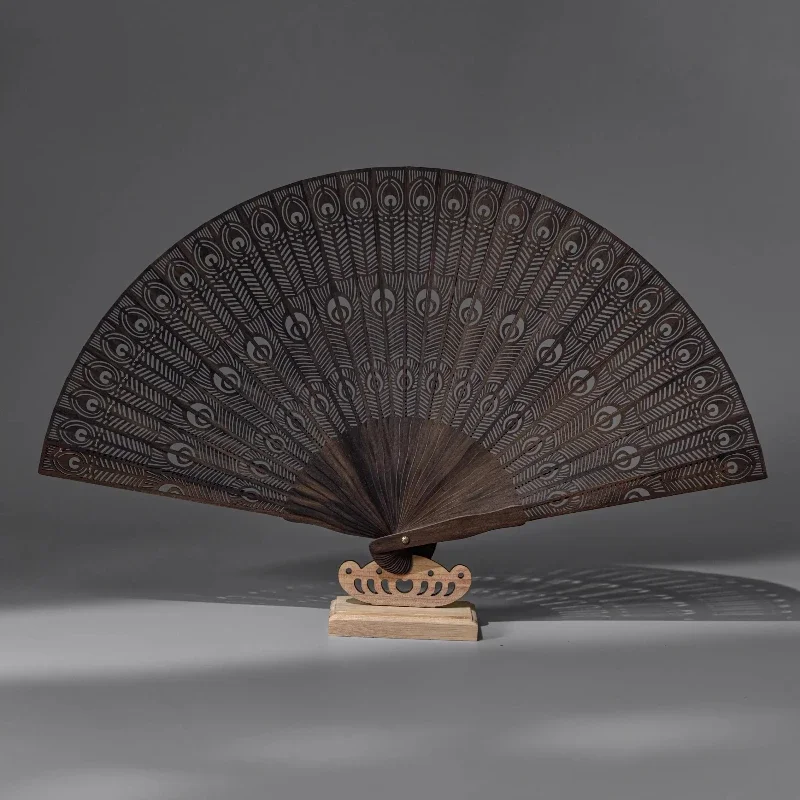 New Chinese hollow peacock open screen folding fan ancient style peacock plume gloomy ebony Su fan national style fan
