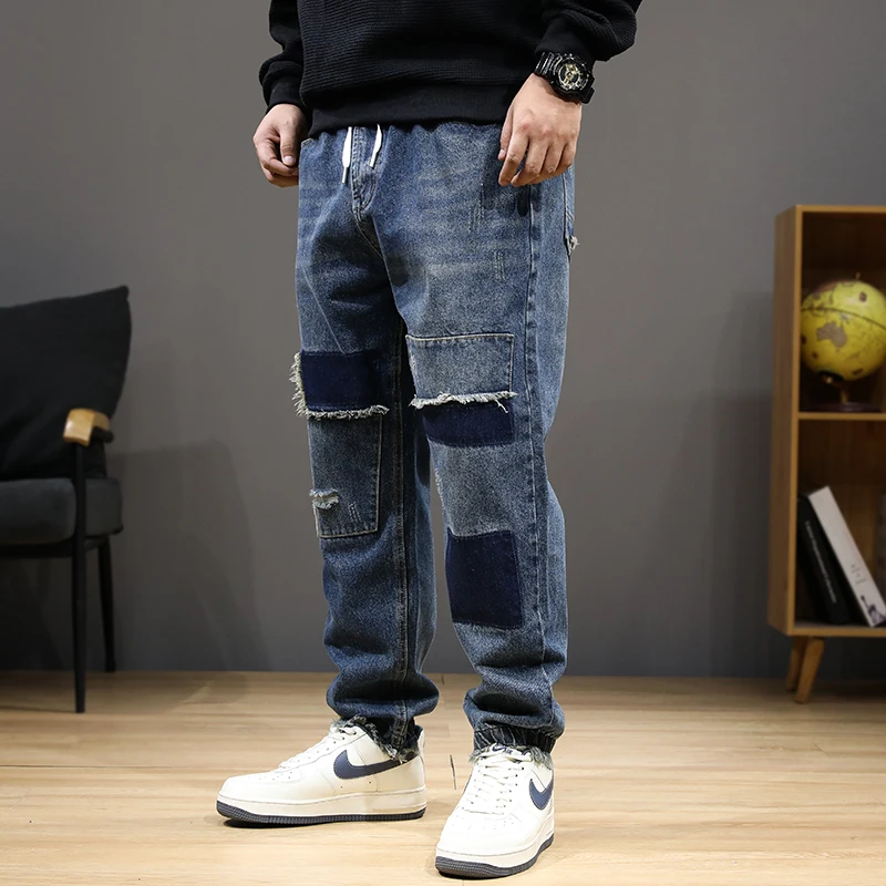 عداء ببطء الجينز الرجال الدنيم السراويل حجم كبير 8XL موضة المرقعة الجينز عادية مرونة الخصر الدنيم السراويل الذكور سراويل كبيرة الحجم