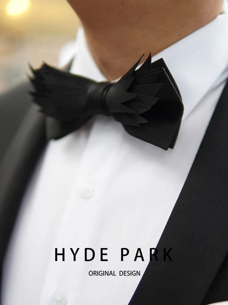 Banquet host with a luxurious black bow tie, wedding groom bow tie, and floral collar