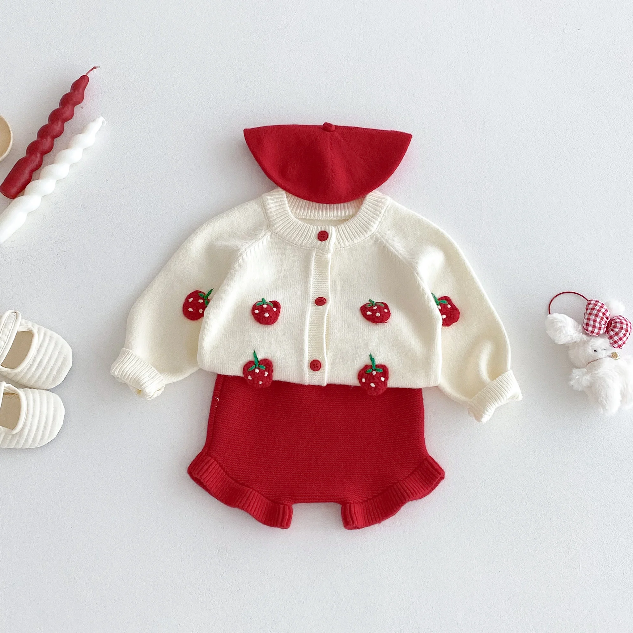 For autumn and winter, a cute strawberry-embroidered cardigan and shorts knitted sweater set for a baby girl to go out