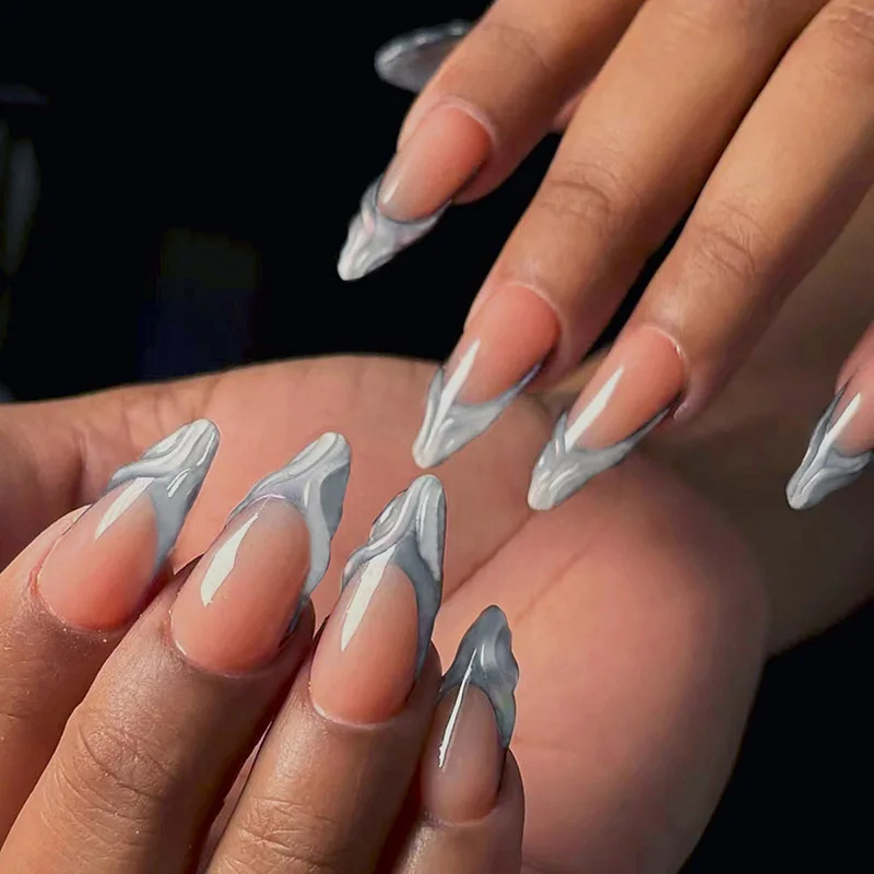 

24 long pressed almond shaped 3D decorative fake nails, paired with 1 piece of jelly and 1 nail file