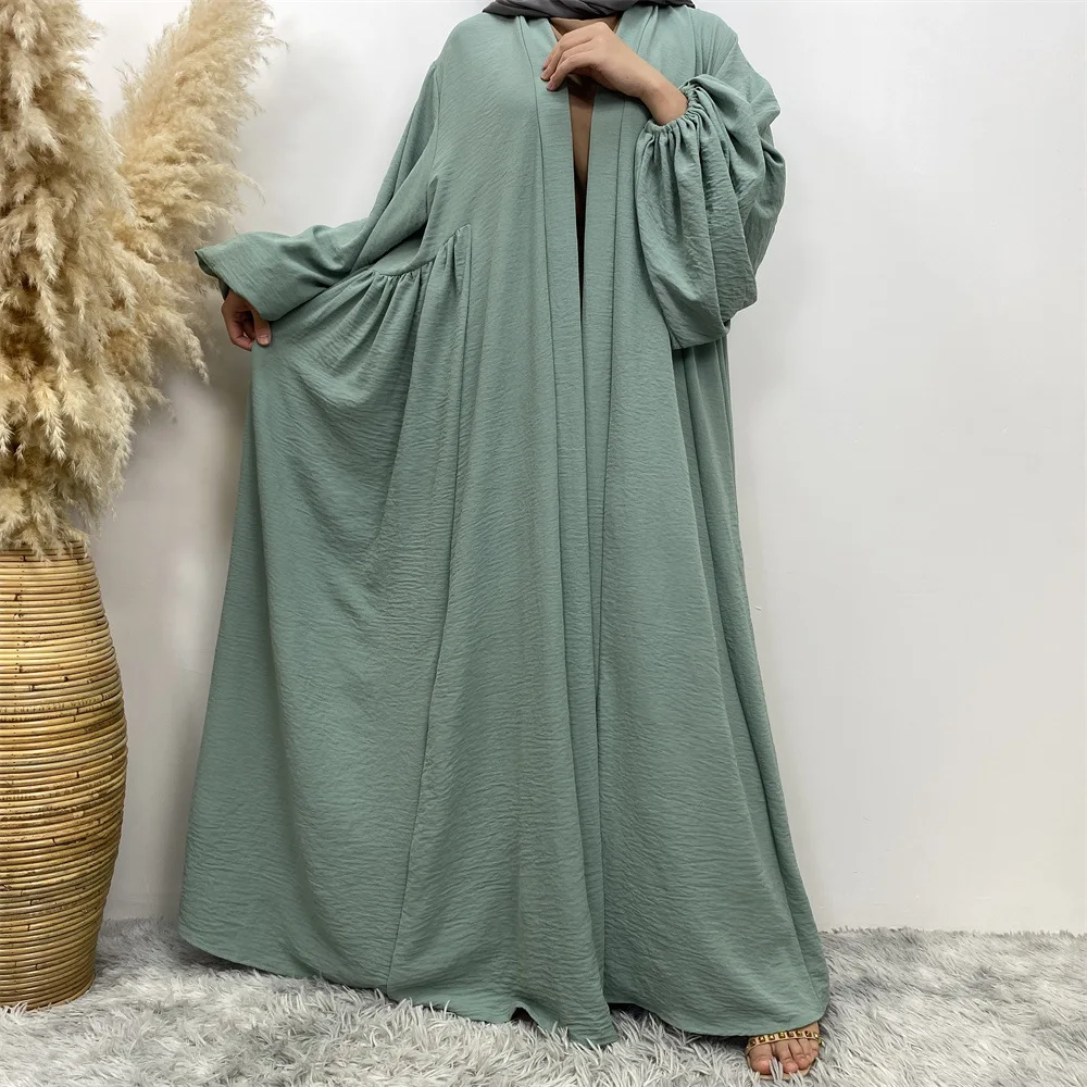 

Women Muslim Middle East Dubai Elastic Cuffs Middle Ruffle Pocket Cardigan Loose Abaya Robe