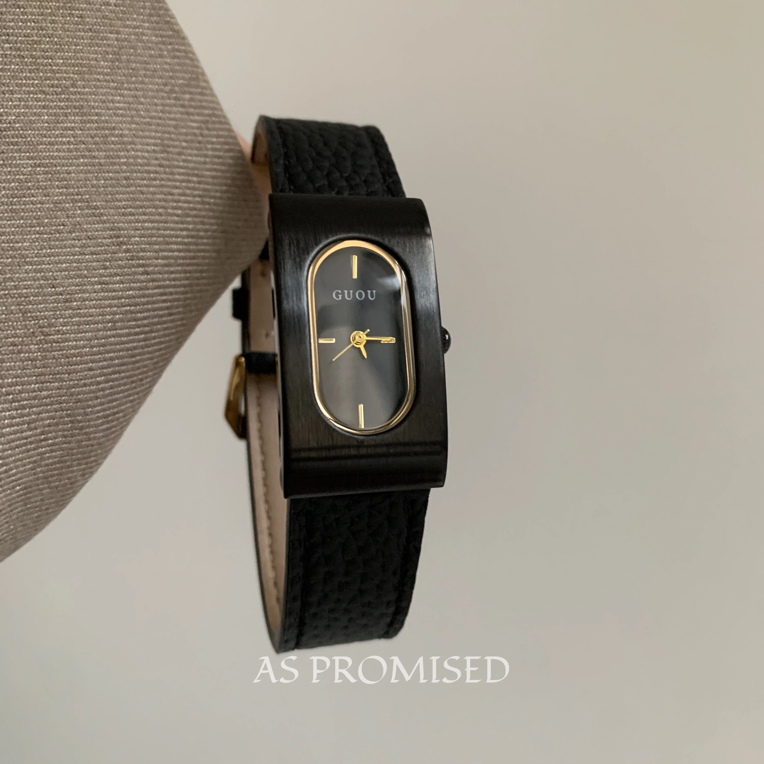 A stylish and classic black rectangular quartz watch for women, featuring a sophisticated design and a high-end, luxurious feel.