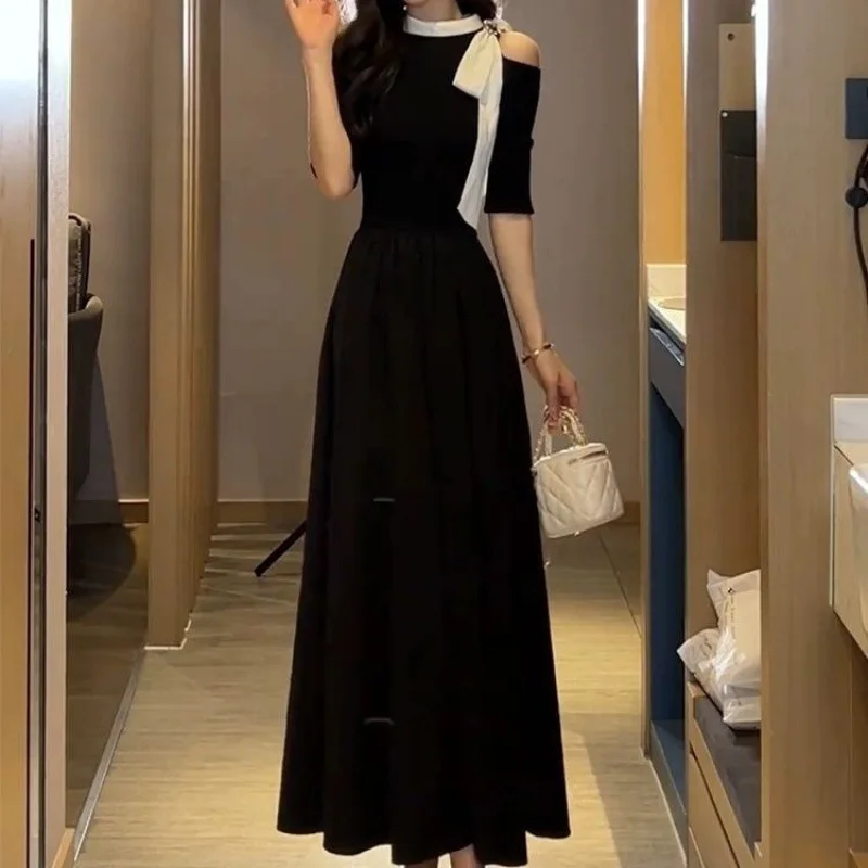 French bow black dress 2024 summer new fashion Joker loose off-the-shoulder waist temperament Hepburn style skirt