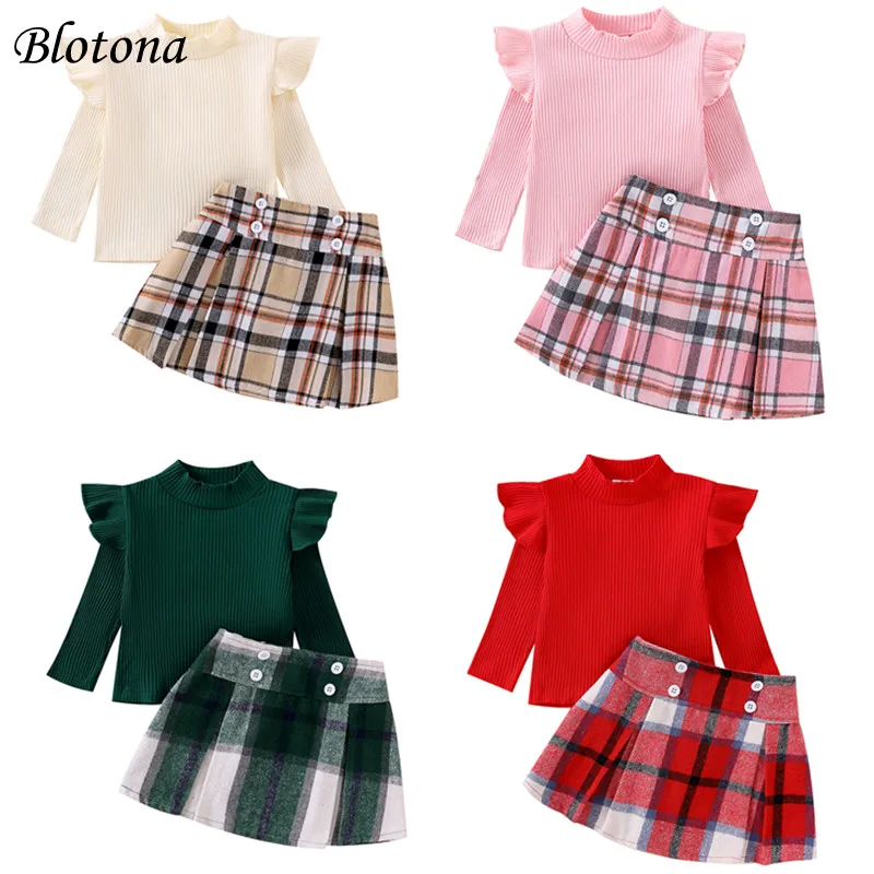 

Blotona Little Girl Fall Fasionable Outfit, Ruffle Long Sleeve Ribbed Solid Color Tops Plaid High Waist A-Line Skirt 2 Piece Set