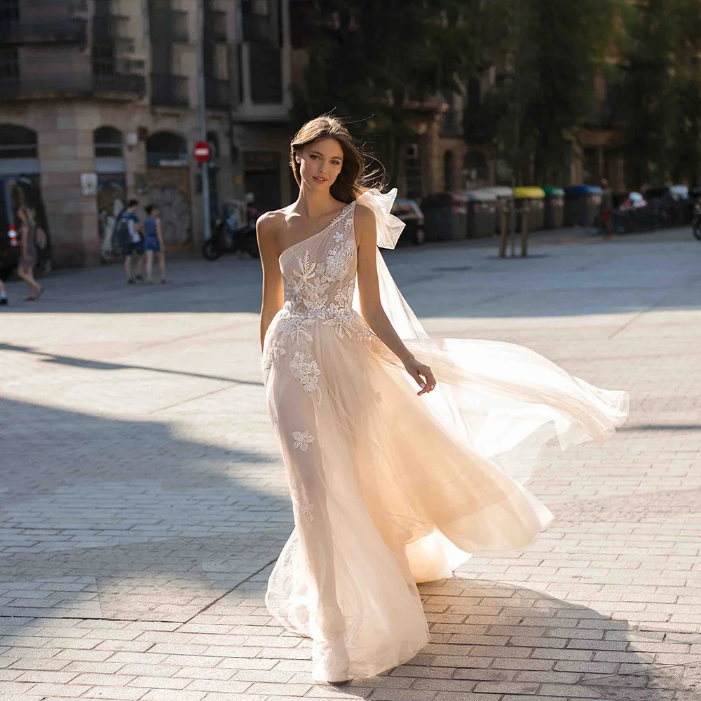 Women's One Shoulder Lace Applique Wedding Dress Champagne Tulle Backless Bridal Gown with Bow Sash Long Train for Wedding Party