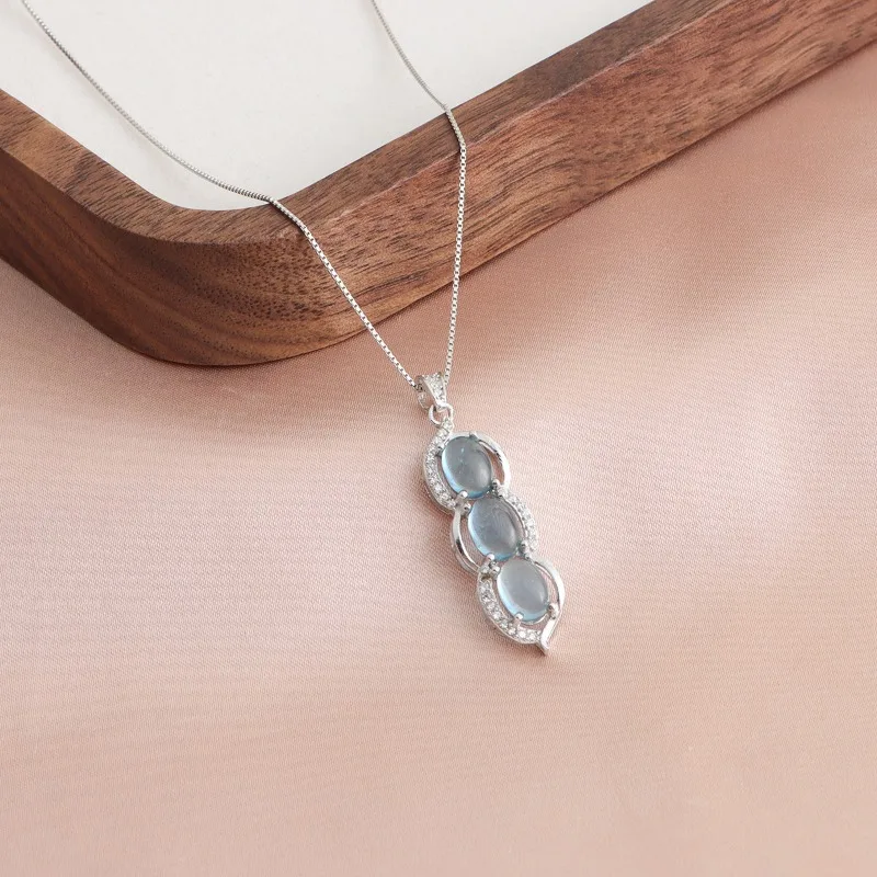 

Minar Unique Design Clear Blue Color Aquamarine Natural Stone Kidney Bean Pendant Necklaces for Women Silver Box Chain Chokers