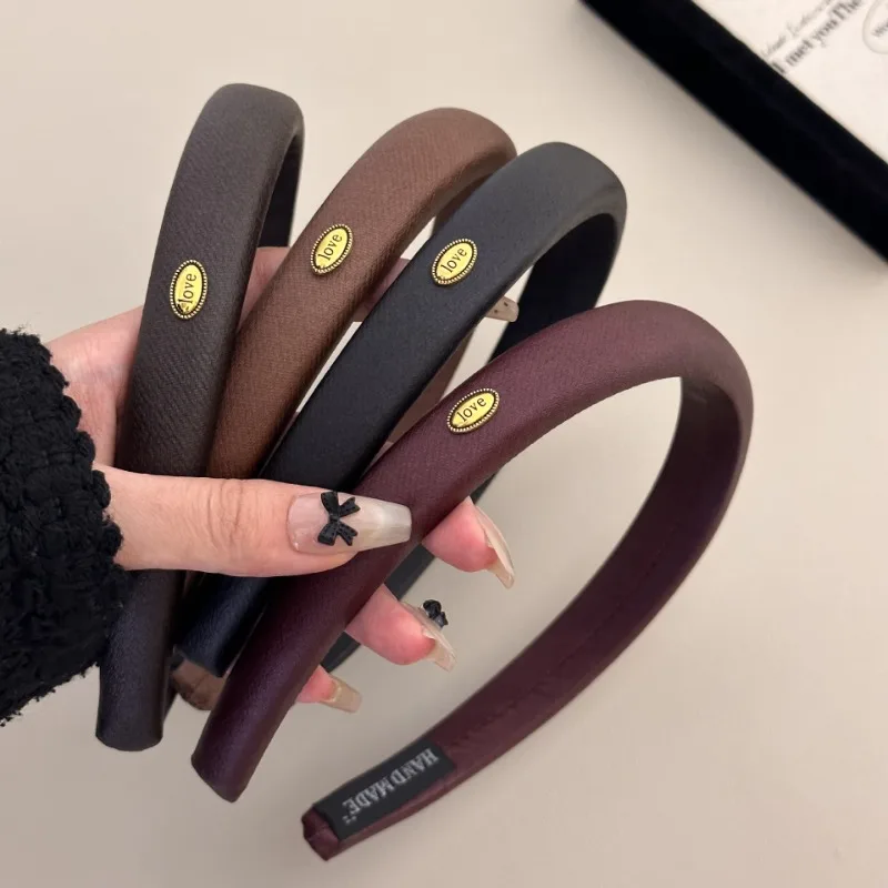 Coreano francese premium fascia in pelle temperamento retrò oro ovale oro etichetta texture fascia accessori per capelli tornante nuovo