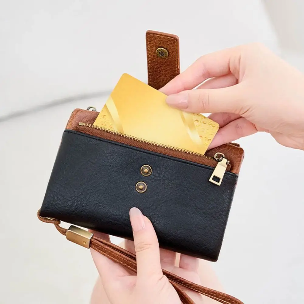 

Компактный кошелек с защитой от RFID-краж, несколькими отделениями для карт, ремешком на запястье и двойным карманом на молнии для монет