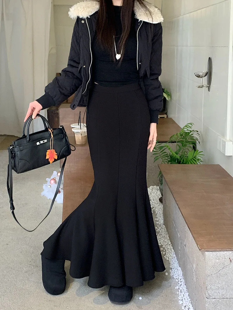 กระโปรงทรงหางปลาสไตล์เกาหลีสำหรับฤดูหนาว ผู้หญิง คุณภาพสูง สีดำ เอวสูง กระชับสัดส่วน กระโปรงยาว ดีไซน์หรูหรา สตรีทแวร์ แฟลดาส