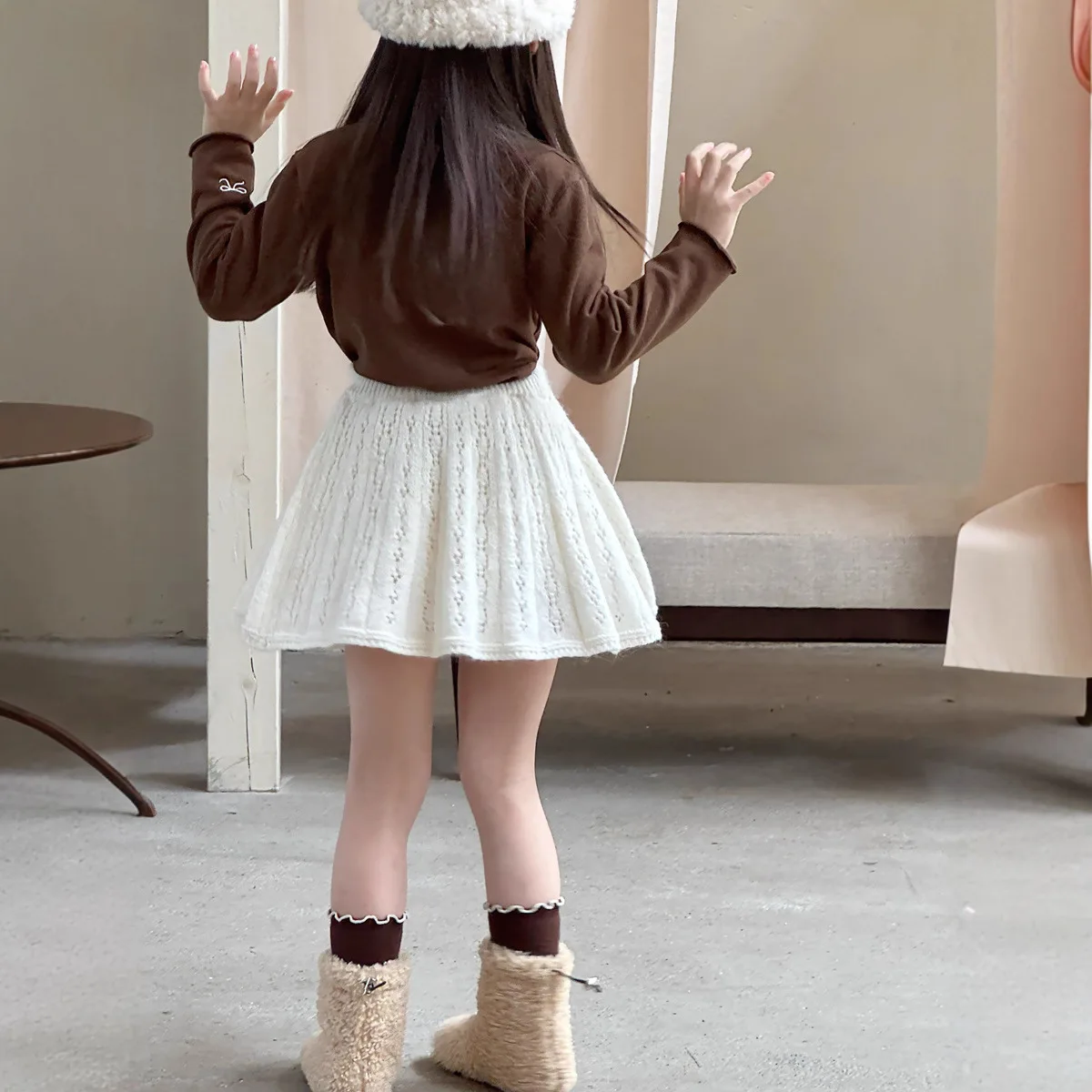 الفتيات نمط المشمش نسيج جوفاء محبوك تنورة الأطفال الخريف والشتاء لطيف الرياح كلمة تنورة