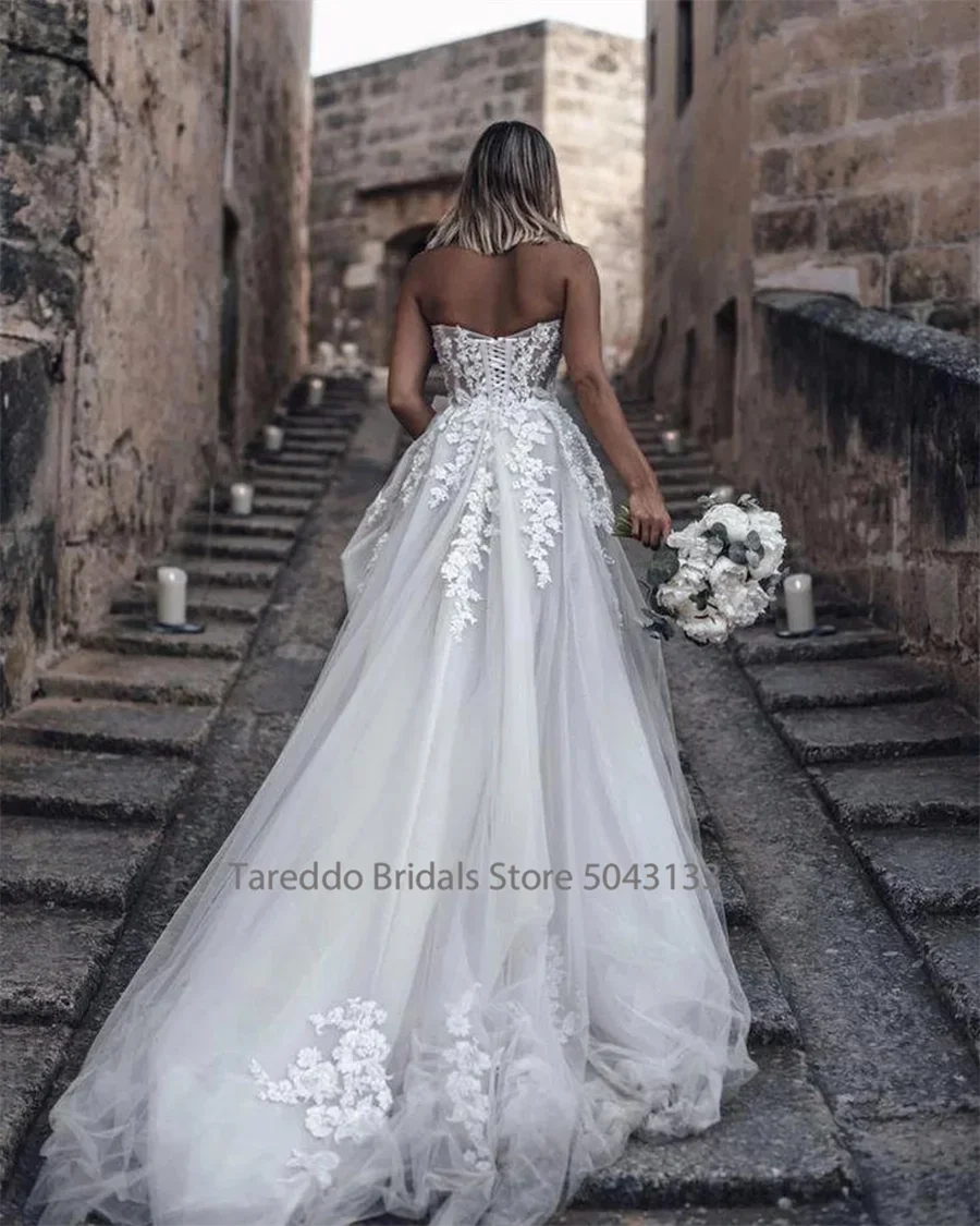 Customized Breathtaking Strapless Wedding Dress Featuring Stunning Crystals Lace Appliques and Flowy Silhouette Bridal Dress