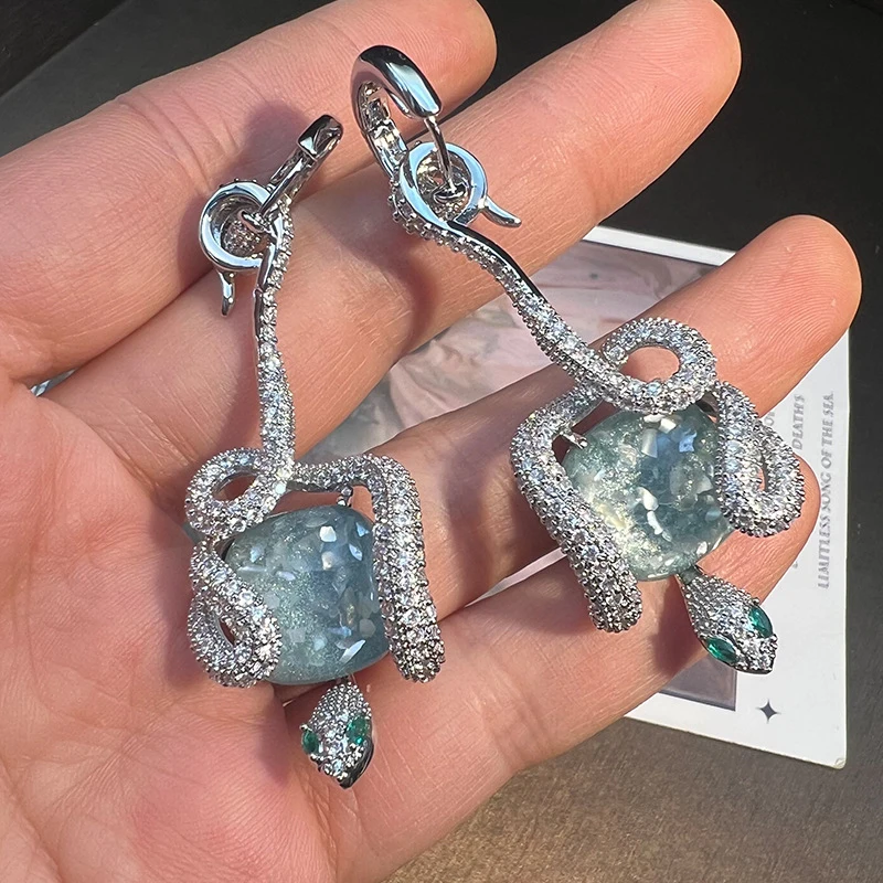 

luxury Sparkling CZ Coil Earrings with Light Blue Center Stone and Green Accents fashion jewelry for women