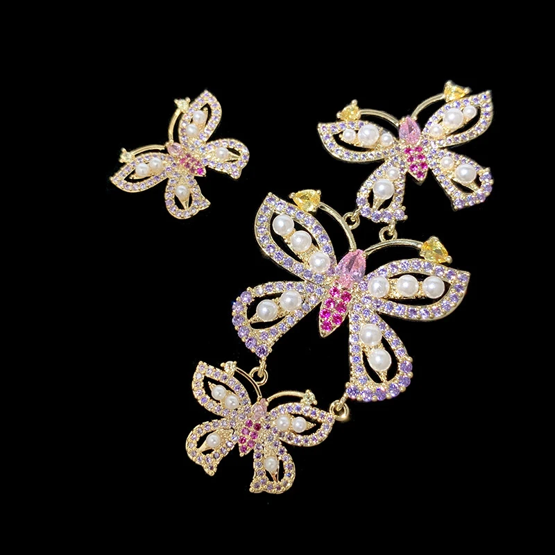 

Asymmetrical Butterfly Drop Earrings with Purple Cubic Zirconia and Faux Pearl fashion prom evening jewelry