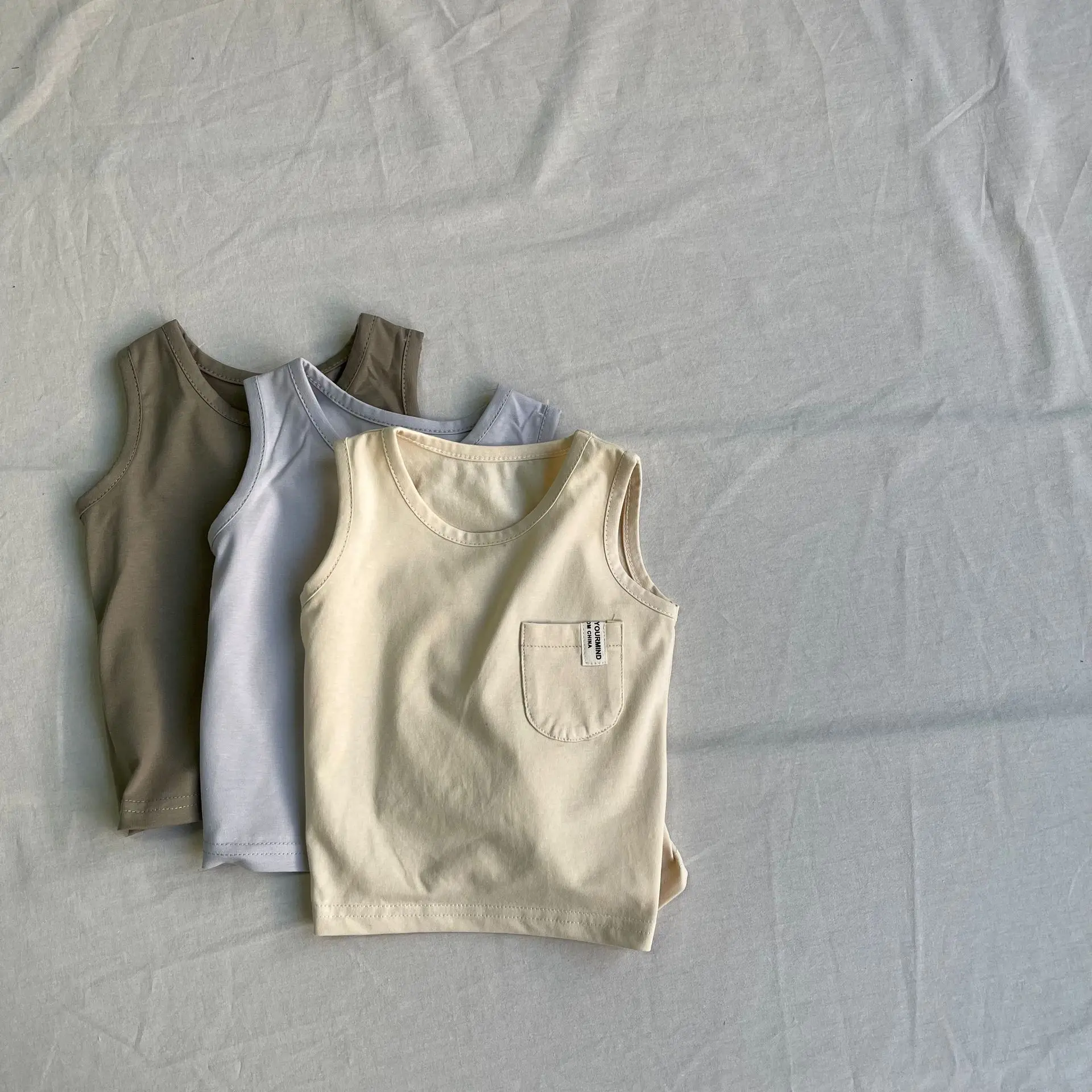 

2025 Summer New Baby Sleeveless T Shirts Infant Loose Cotton Vest Boys Girls Breathable Casual Tops Solid Color Toddler Clothes