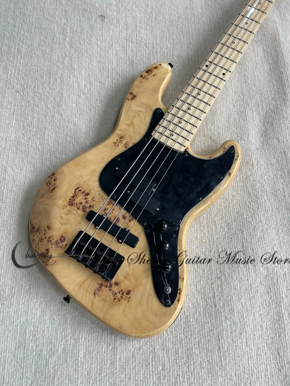 5 strings natural bass, ASH body, Burl maple top,maple fingerboard,fixed bridge, 3 pickups, black tuner, active lines