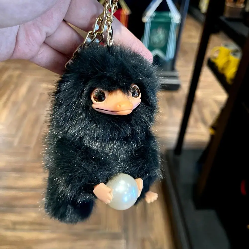 Universal Beijing Resort's Magic Academy Pet - Black Niffler Holding a Ball Plush Keychain, Backpack Ornament, Gift & Souvenir