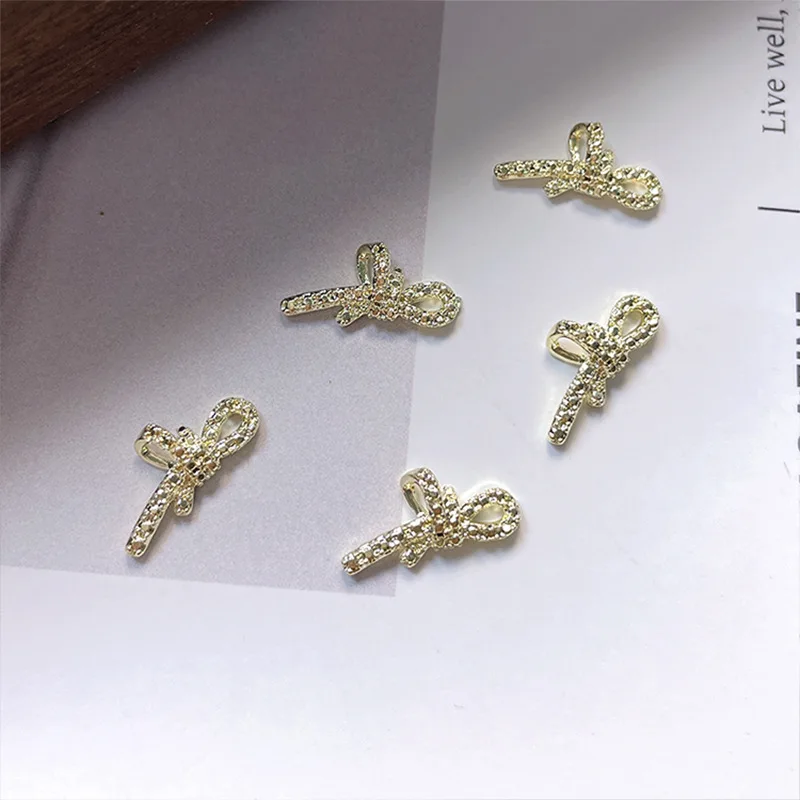 20PCS 3D 골드 금속 Bowknot 네일 아트 나비 매력 나비 넥타이 액세서리 매니큐어 장식 손톱 장식 용품 재료