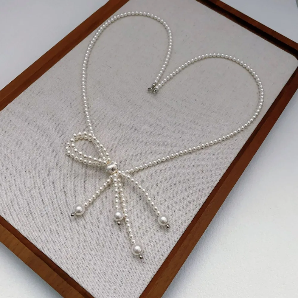 

Japanese Korean Style New Glass Pearl Strand Chain Hand-beaded Bow Pendant Exquisite Light Luxury Versatile Necklace for Women