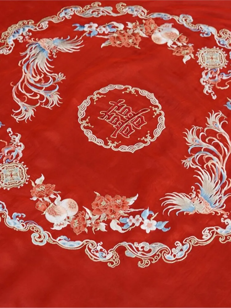 The wears a traditional Chinese wedding dress phoenix crown red veil and