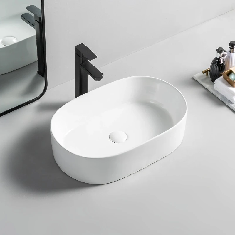 

Install the bathroom sink above the oval ceramic wash basin counter