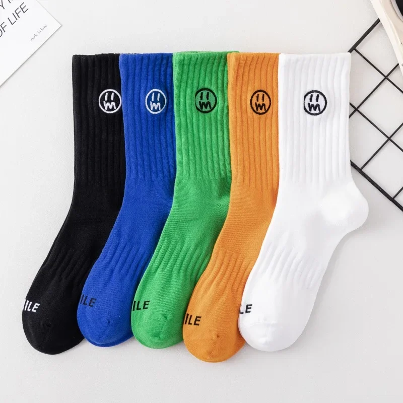 

5 pairs of men's trendy embroidered smiling face mid tube socks breathable sporty sweat absorbing simple casual cotton socks