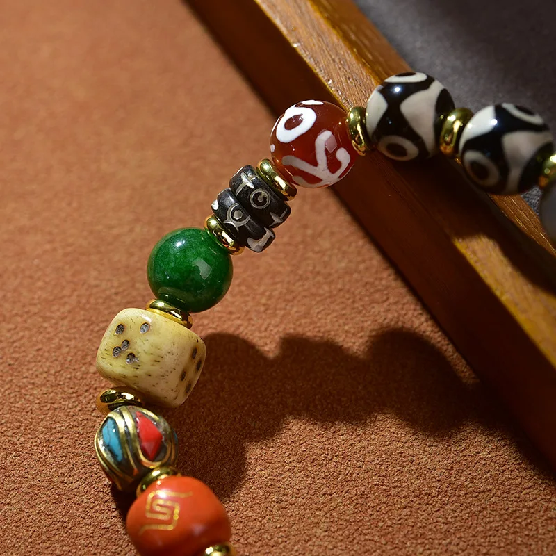 Tibetan-style -bead Dzi bracelet with multiple totems multi-eye designs symbolizing fortune and wealth,