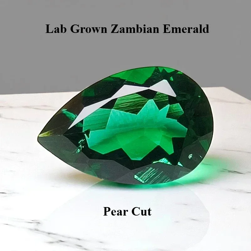 

Lab Grown Zambian Emerald Pear Shape Hydrothermal Hand Cutting Cut with Cracks Inclusions Inside Selectable AGL Certificate