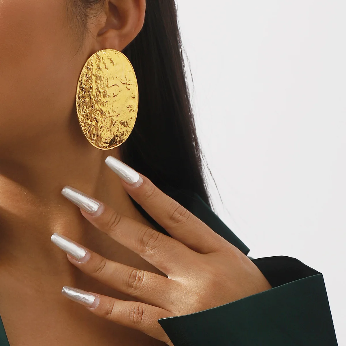 Minimalist style exaggerated alloy oval earrings with textured concave convex geometric metallic feel, fashionable earrings