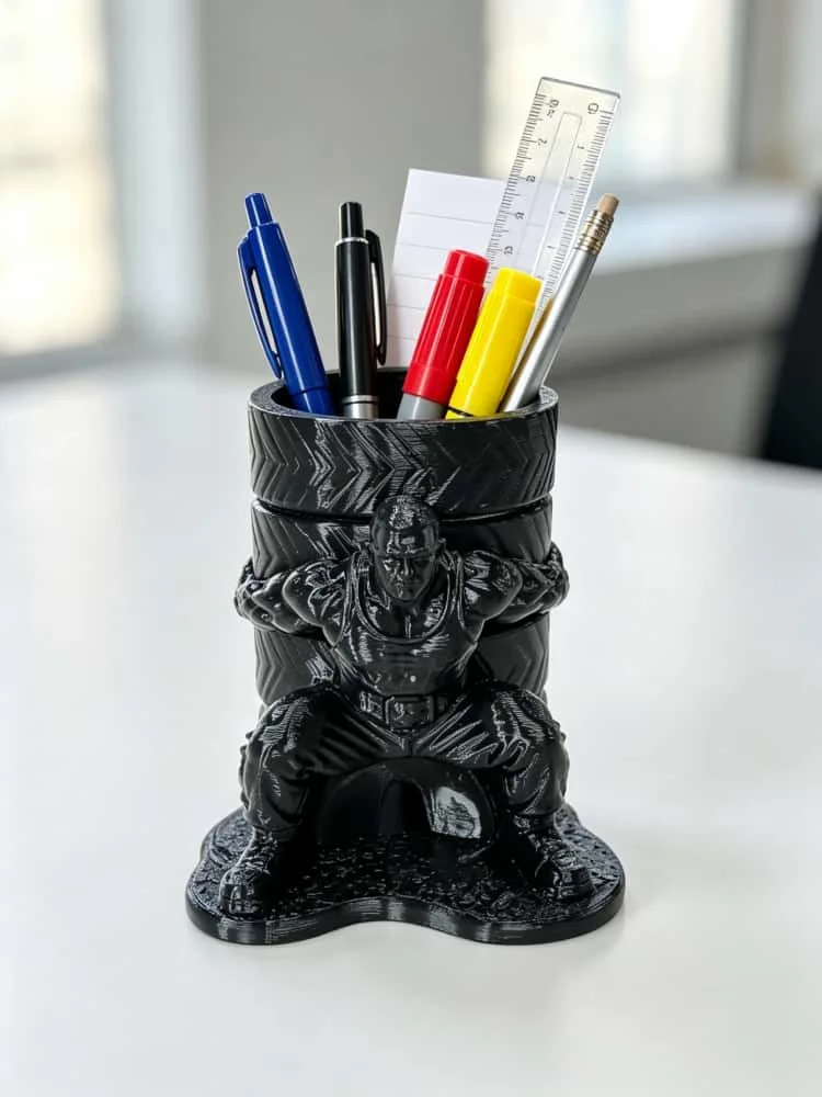 Muscular Man Pen Holder with Tire-Shaped Strongman Sculpture, Creative Human-Shaped Fun Figurine Pen Holder, Petg Matte Plastic Solid Resin Texture Large Capacity Pen Cup, Stable Base Space-Saving Desktop Organizer, Can Hold Fountain Pens, Pencils, and Stationery, Quirky and Cool Desktop Decoration, Suitable for Office, Student Desks, Novelty Gift for Fitness Enthusiasts, Personalized Office Desk Decoration Accessory
