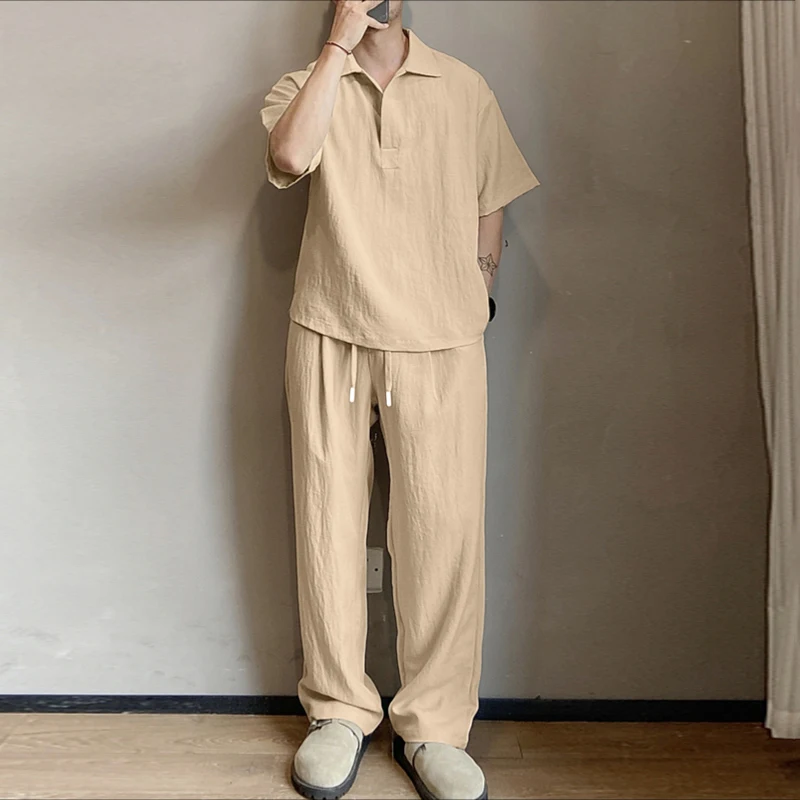 

INCERUN Мужские комплекты Однотонная рубашка с короткими рукавами и брюки с лацканами Комплекты из двух предметов Свободная уличная одежда 2025 Мужские повседневные костюмы S-5XL