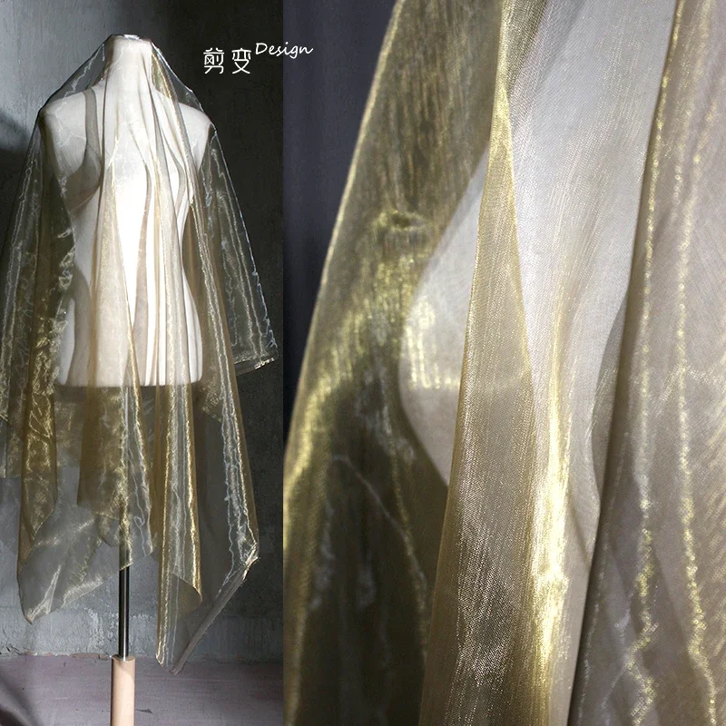 

Gold silk water light gauze material thin soft creative organza mesh veil skirt clothing background designer fabric