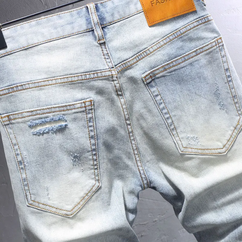 

Street Fashion Men Jeans Retro Light Blue Stretch Slim Patched Designer Ripped Jeans Men Y2K Vintage Casual Denim Pants Hombre