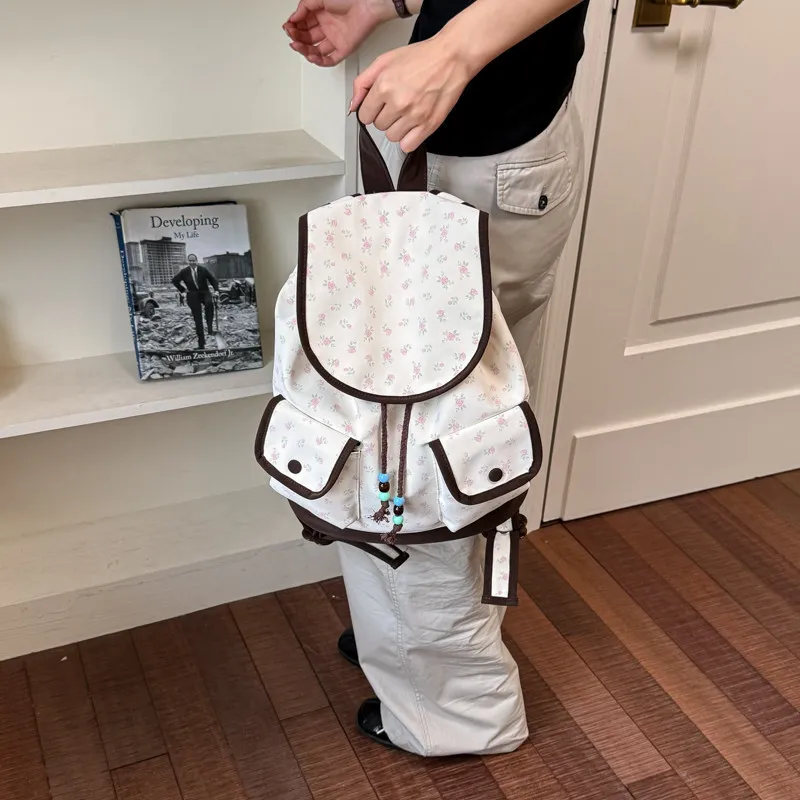 2026New floral print sweet canvas drawstring backpack for women, large capacity, lightweight, suitable for college students and