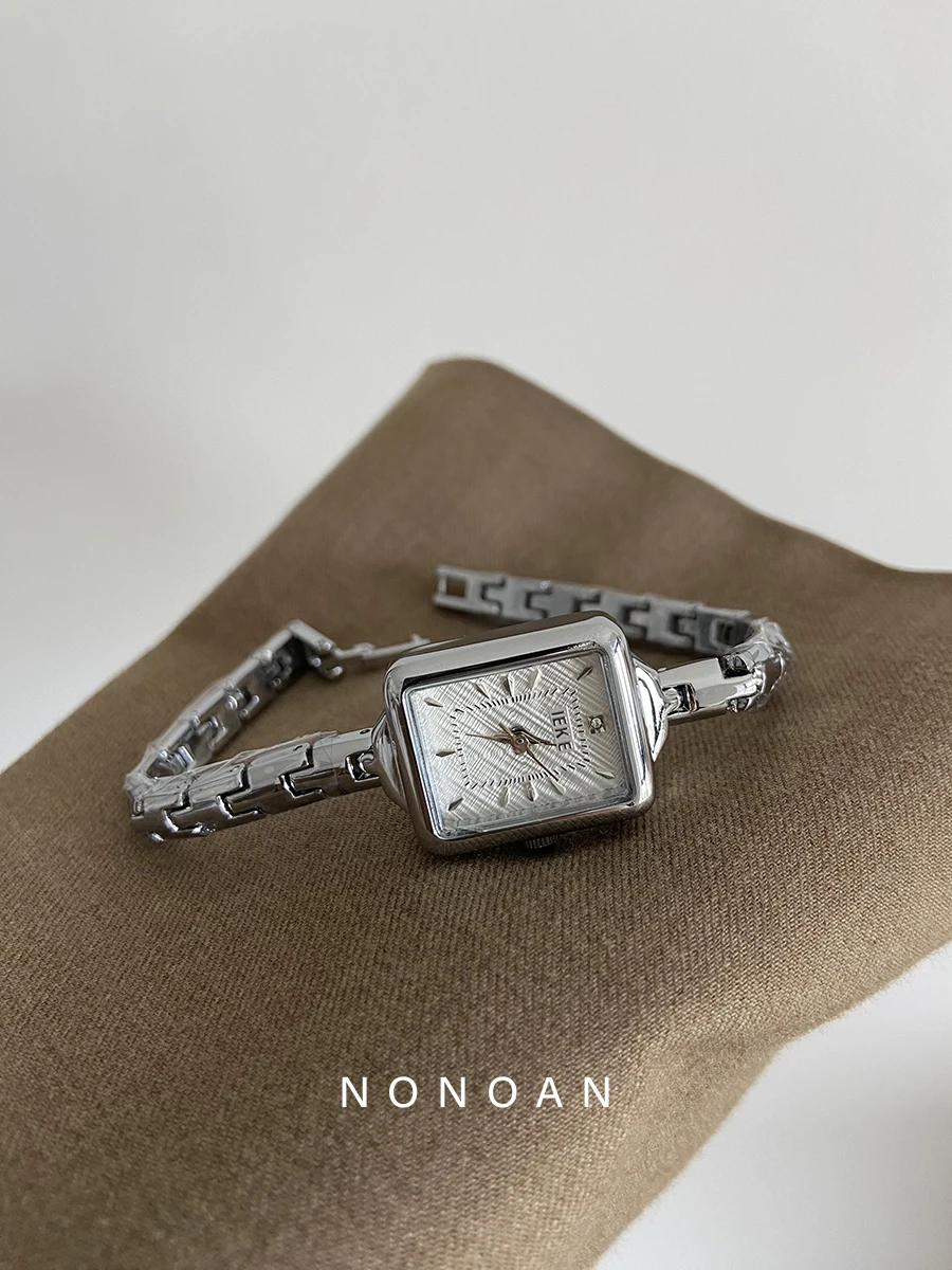 A sophisticated women's watch with a delicate bracelet and square dial, exuding elegance and style. A perfect gift for ladies.
