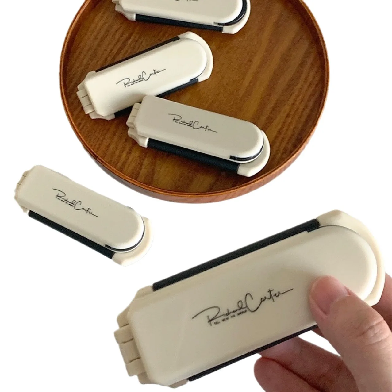 A portable folding comb with mirror - anti-static mini travel size, suitable for daily and travel use, durable plastic material